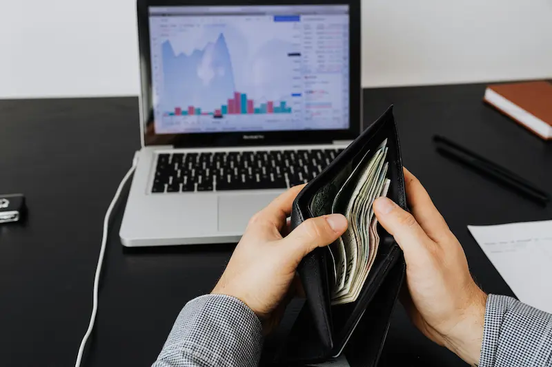 small business owner reviewing website costs on a laptop